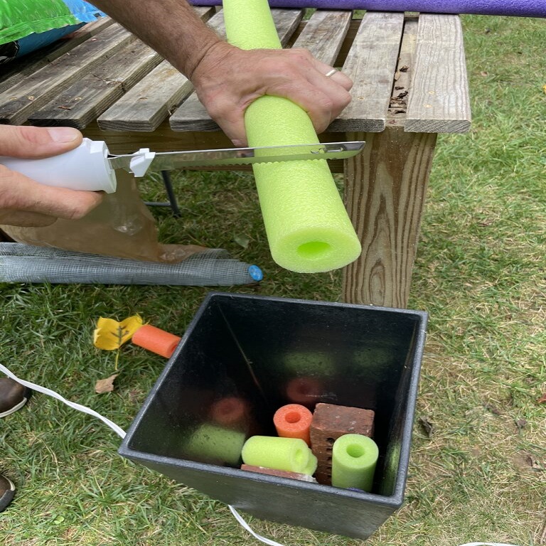 pool noodles in flower pots